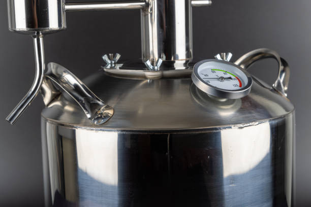 istock brand new stainless steel alcohol machine on black background 2093847789