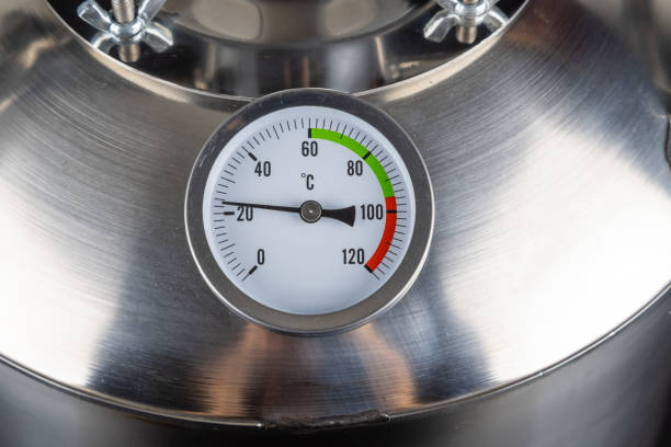 istock brand new stainless steel alcohol machine on black background 2093848304