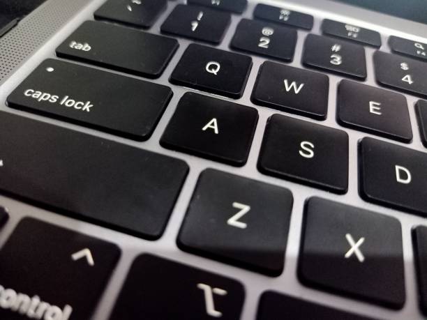 istock Black laptop keyboard on silver laptop 2093861827