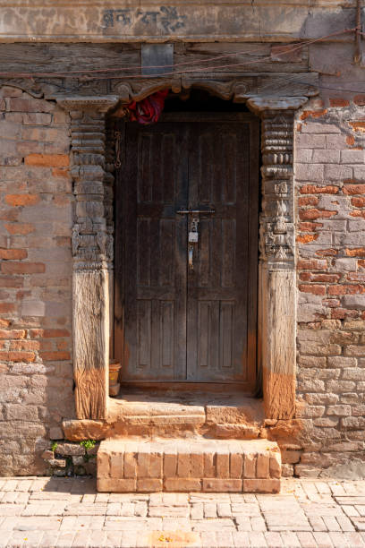 istock Closed Wooden Door in Brick Wall 2093880203