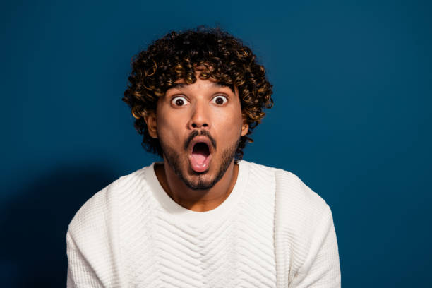 istock Photo of impressed funky guy dressed white pullover big eyes open mouth isolated dark blue color background 2093885990