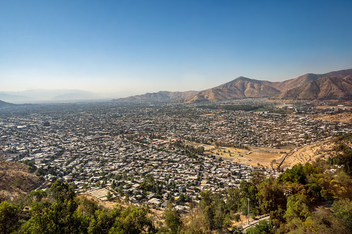wide panoramic view on the valley of Santiago de Chile  with mountain range in the background