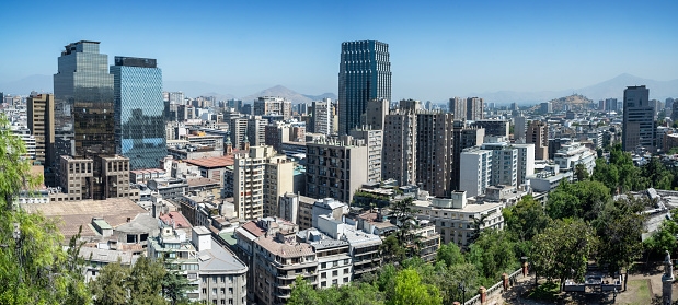 elevated view on modern Santiago skyline with mountain range in the background