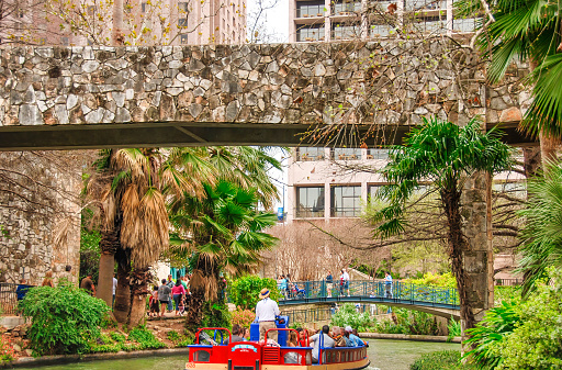 San Antonio, TX - March 16, 2008: Tourists and locals along the city river on a boat tour.