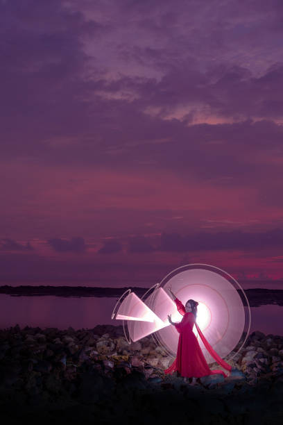 istock Model light painting at the beach 2093973963