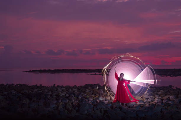 istock Model light painting at the beach 2093973965