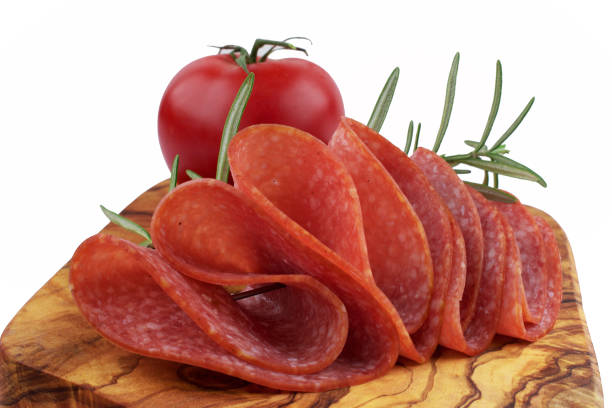 Salami smoked sausage slices on background