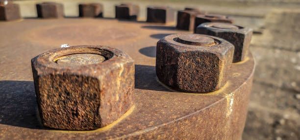 big bolts on pipe for crude oil and gas - flanges flange bolt oilfield zdjęcia i obrazy z banku zdjęć