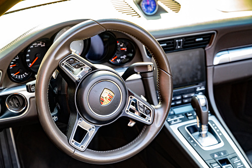 Porsche 911 Cabriolet (generation 991) sports car interior. The car is parked on a street in Zwolle, Netherlands.