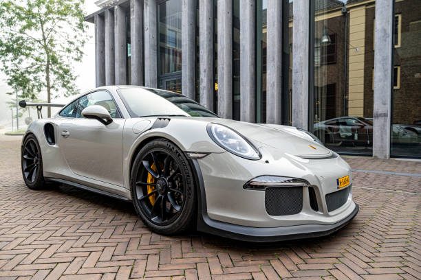 Porsche 911 GT3 RS sports car generation 991 driving on the street in Zwolle. The GT3 RS is a lightweight performance version of the Porsche 911 with improved aerodynamics.