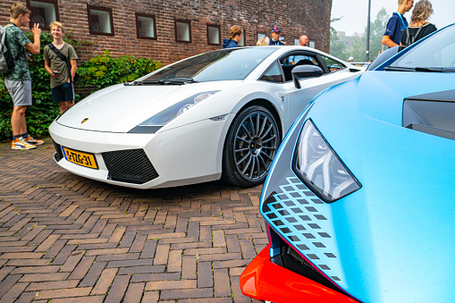 Lamborghini Gallardo Superleggera and Lamborghini Huracán STO sports cars parked on a street in Zwolle, Netherlands. The STO is a high performance edition of the Lambo Huracan with extreme aerodynamics, track-honed handling dynamics, lightweight contents and a high performing V10 engine.
