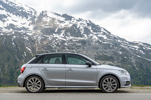 Audi A1 Sportback compact hatchback car parked on the side of the road on the Timmelsjoch Mountain pass in the Austrian Alps.