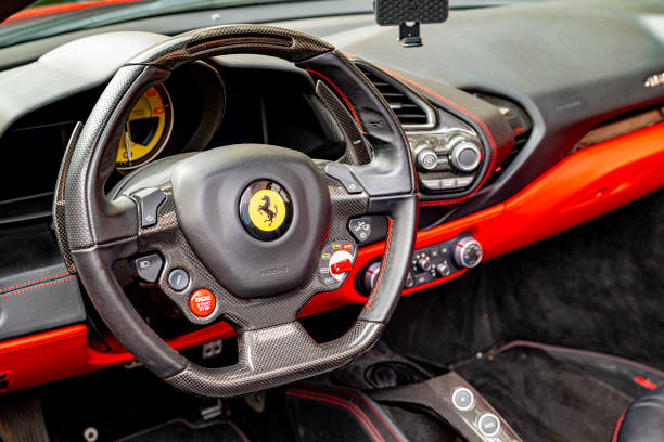 Red Ferrari 488 Spider sports car parked on the street in Zwolle, The Netherlands. The Ferrari 488 GTB (Tipo F142M) is a mid-engined sports car powered by a 3.9-litre twin-turbocharged V8.