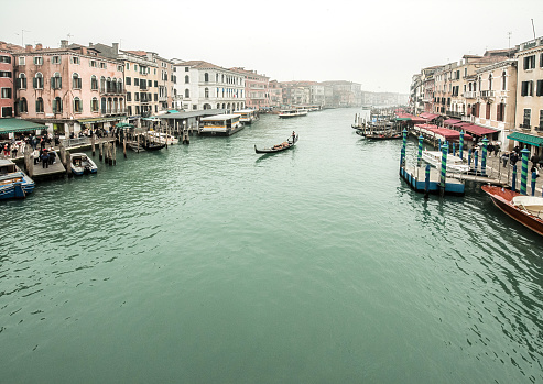 Venice, Italy - February 21, 2022: Looking out across the magnificent Grand Canal in Venice from the iconic Rialto Bridge.