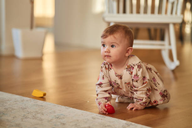 istock Beautiful baby girl crawling 2094004999