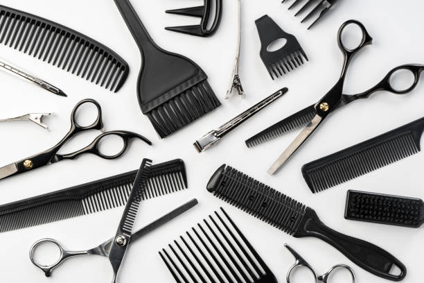 istock Black hairdressing tools and various hairbrushes on white background 2094005650
