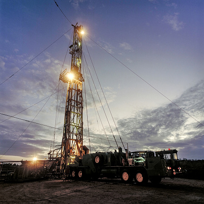 Drilling of an onshore oil well at dusk. Bahia, Brazil.