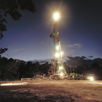 Drilling of an onshore oil well at dusk. Bahia, Brazil.