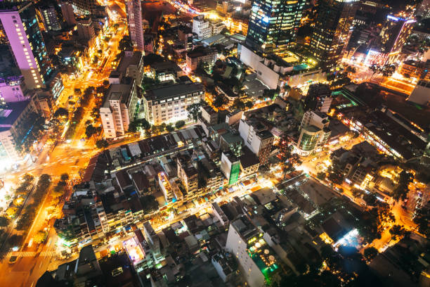 Twilight cityscape of Saigon, showcasing the vibrant lights and busy streets of this dynamic Vietnamese metropolis, with a focus on urban life.