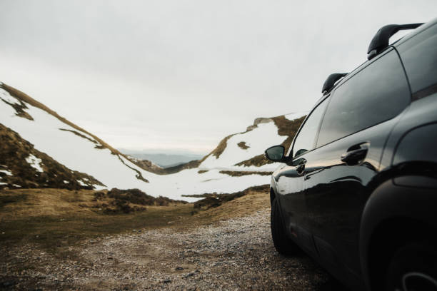 Detail of a car on a road with snow