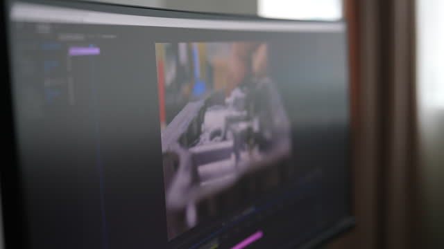 Tracking shot of unrecognizable creative filmmaker editing video footage using modern technology. Closeup of content creator working on montage of film in new software