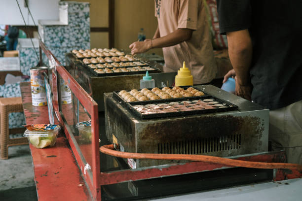 istock A man is cooking takoyaki in Bogor, Indonesia 2094053303
