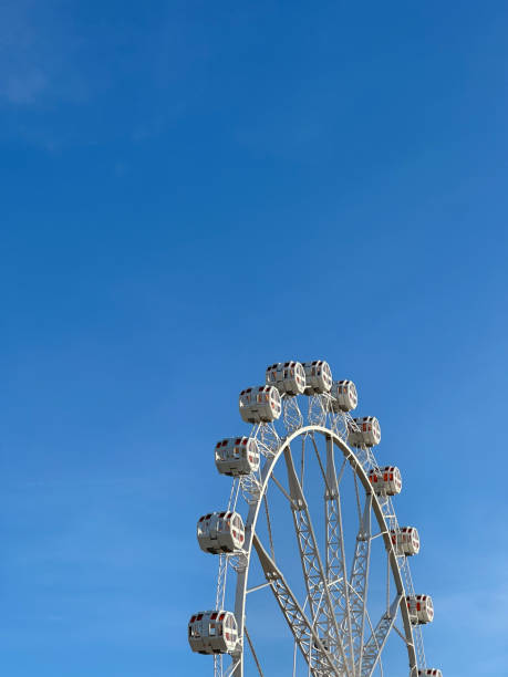 istock View of a ferris wheel with a clear blue sky 2094055960