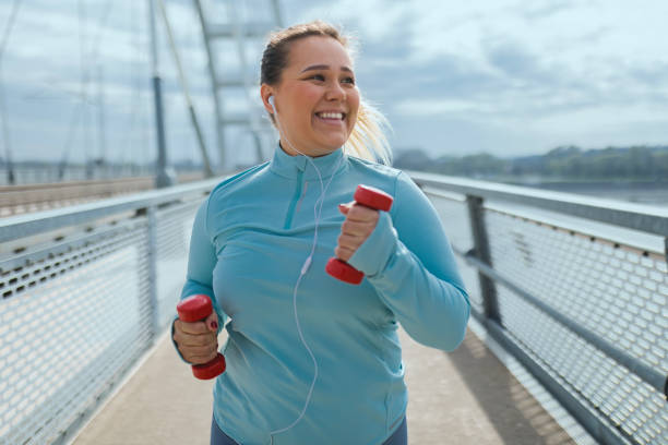 istock Plus-Size Woman's Dumbbell Fitness 2094057572