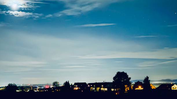 istock Mystic Night with moon and illuminated houses 2094062376