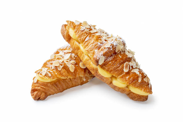 istock Stacked Vanilla Cream Croissants with Almond Flakes on White Background 2094063452