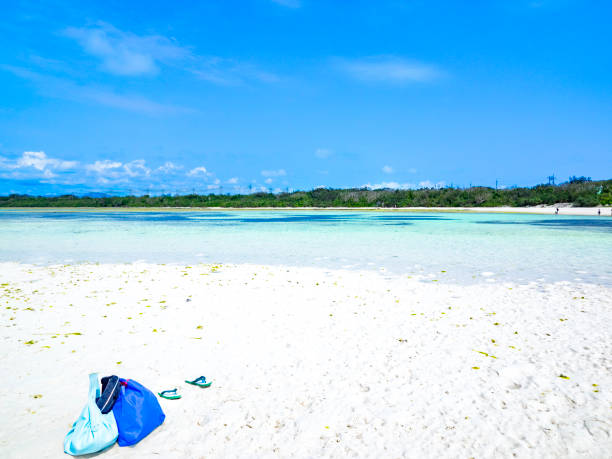 Turquoise blue waters and white sand sandy beach in Taketomi island Okinawa