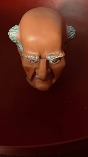 Dark grandfather head from above