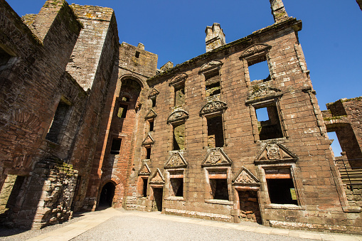 Caerlaverock Castle is a moated triangular castle which was first built in the 13th century. It was destroyed and rebuilt multiple times, by both the English and Scots, during the Scottish war of independence.