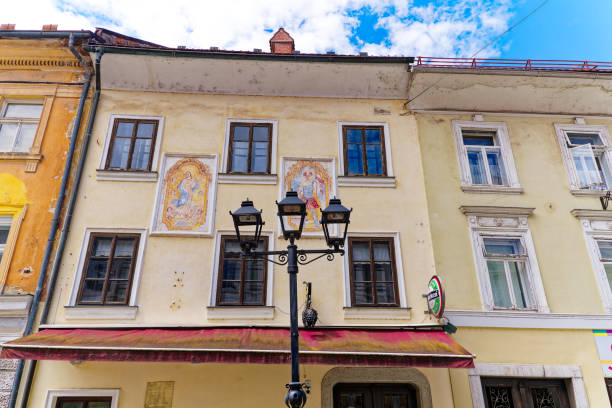Idyllic view of the old town of Slovenian City of Kranj with facade of historic house on sunny summer day. Photo taken August 11th, 2023, Kranj, Slovenia.