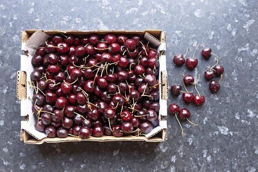 Wallpaper of cherries in a wood box picked in the town of San Climent, Barcelona, Spain
