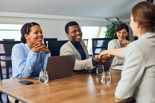 istock Business colleagues having a meeting at the office, doing a handshake. 2094091033