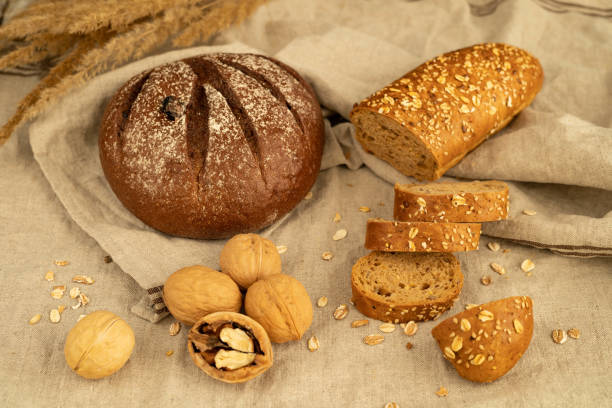 istock Lean rye bread, cereal baguette with sunflower seeds, walnuts 2094099810