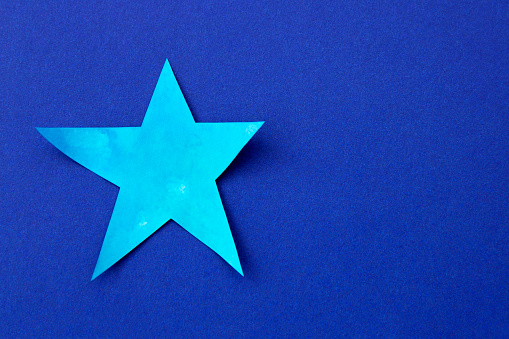 Celestial star on deep blue background
