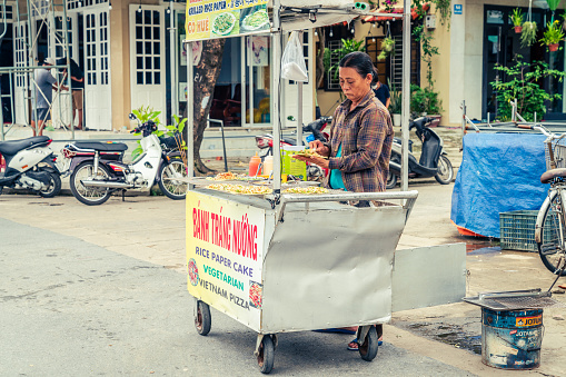 Hoi An, Vietnam, November 20, 2022: Food cart at a street market in the town of Hoi An, Vietnam