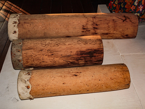 The three rustic drums, made from hollow tree trunks and animal skins, are often played at folk festivals in Maranhão, Brazil.