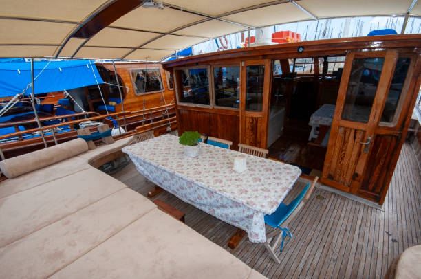 istock Wooden yacht deck with dining table 2094167834