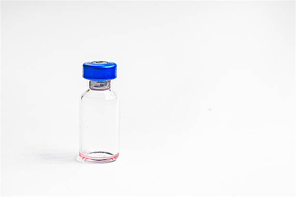 istock glass bottles on a white background. Routine vaccinations for animals and people 2094184836