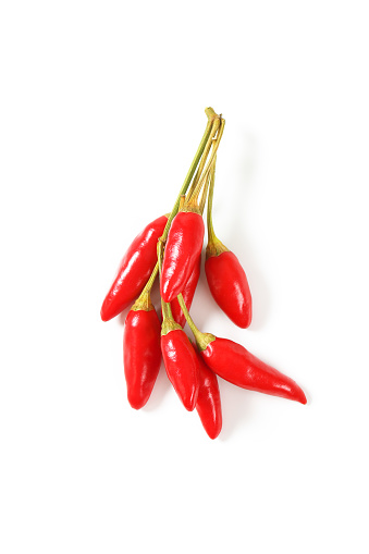 Small red chili peppers on white background