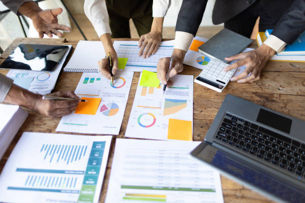 istock Meetings to discuss investment advisors together analyzing financial data, business growth graphs and charts, and planning business strategies. 2094196352