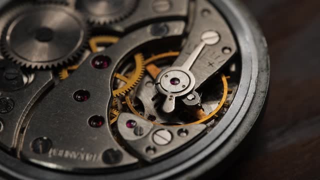 The mechanism of analog hours. A photo close up,