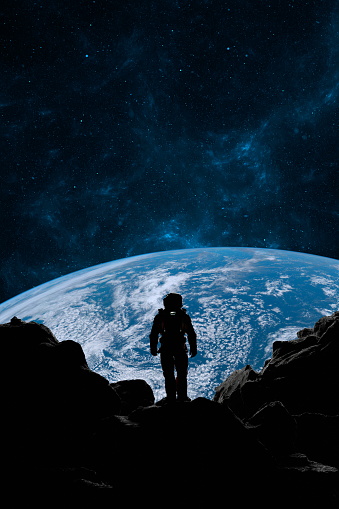 Astronaut stands on a foreign planets surface, looking towards Earth against a backdrop of stars. 3d render