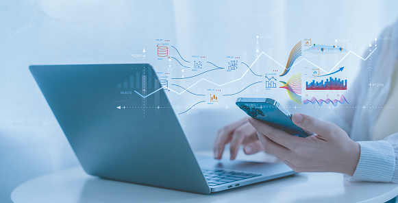 Businessman works on laptop Showing business analytics dashboard by ai with charts, metrics, and KPI to analyze performance and create insight reports for operations management. Data analysis concept.