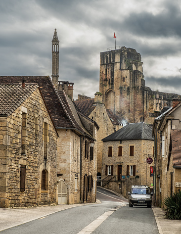 Carlux, Nouvelle-Aquitaine, France - 17th March 2024: Chateau de Carlux and an 13th century chimney in the village of Carlux in the Dordogne region of France