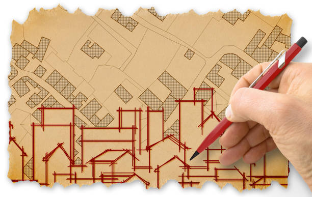 istock Engineer drawing a residential building over an imaginary cadastral map of territory with buildings, fields and roads - Retro style concept image with recycled cardboard with torn edges 2094258171