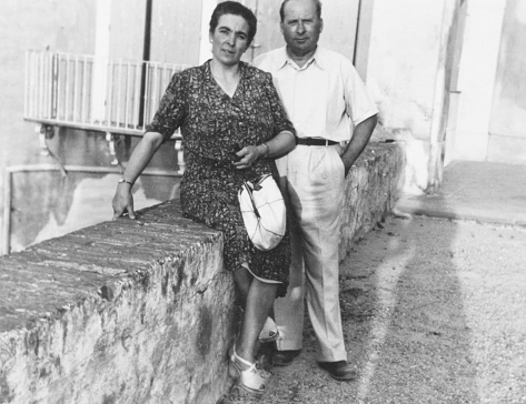 Mature couple standing in a road. 1952.